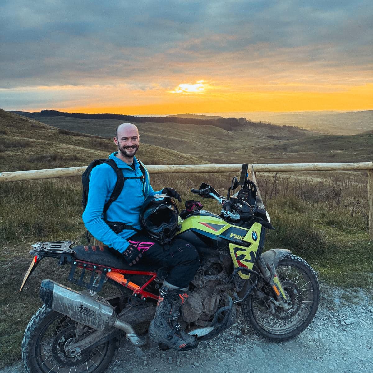 Portrait of Tom with his BMW F 900 GS at sunset